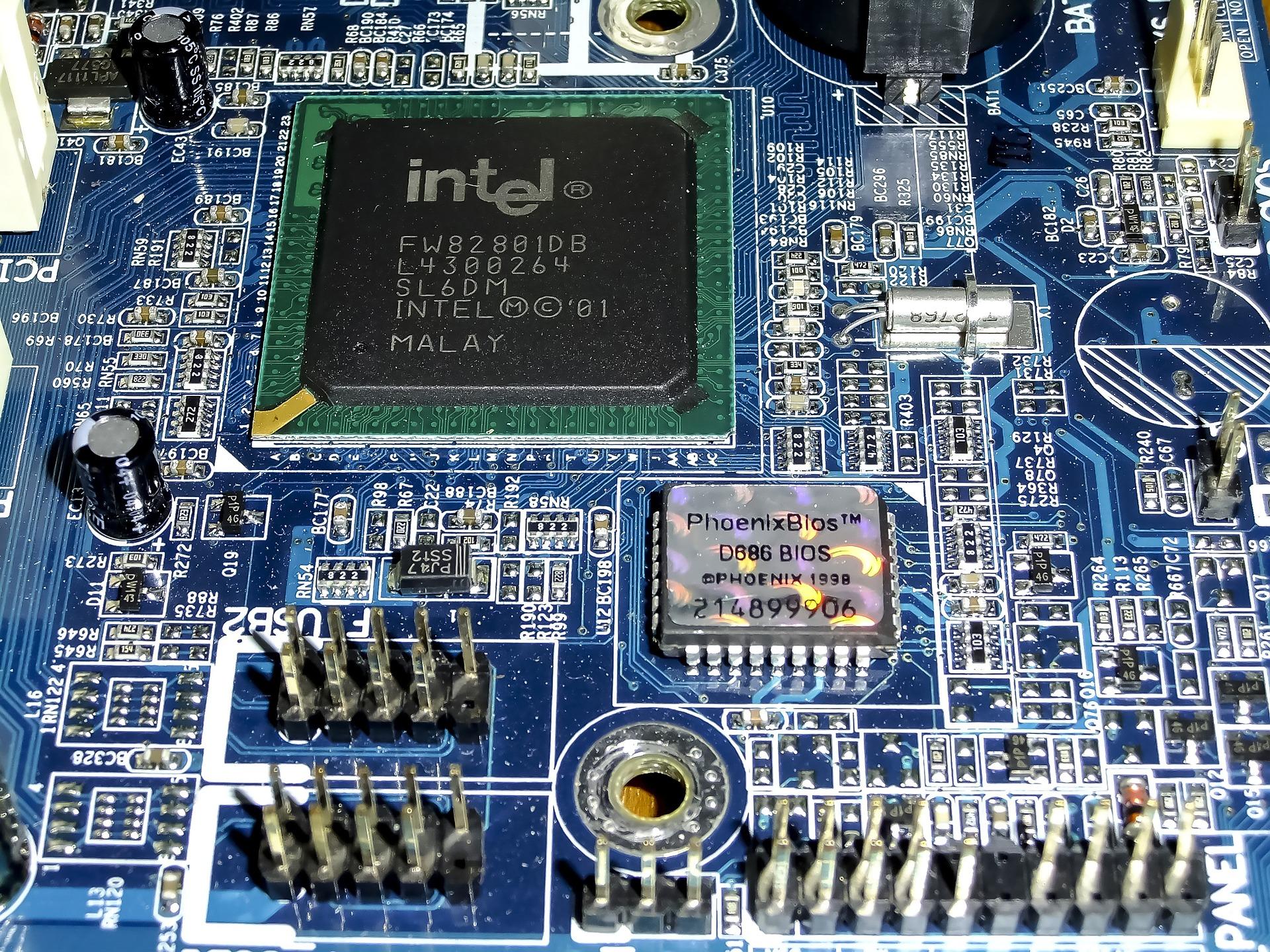 A light blue motherboard showcasing a large C. P. U.